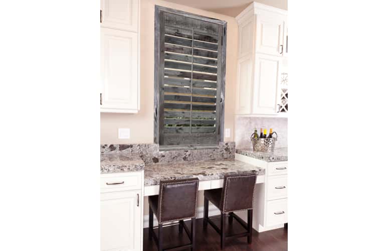 Reclaimed wood shutters on kitchen window in New York